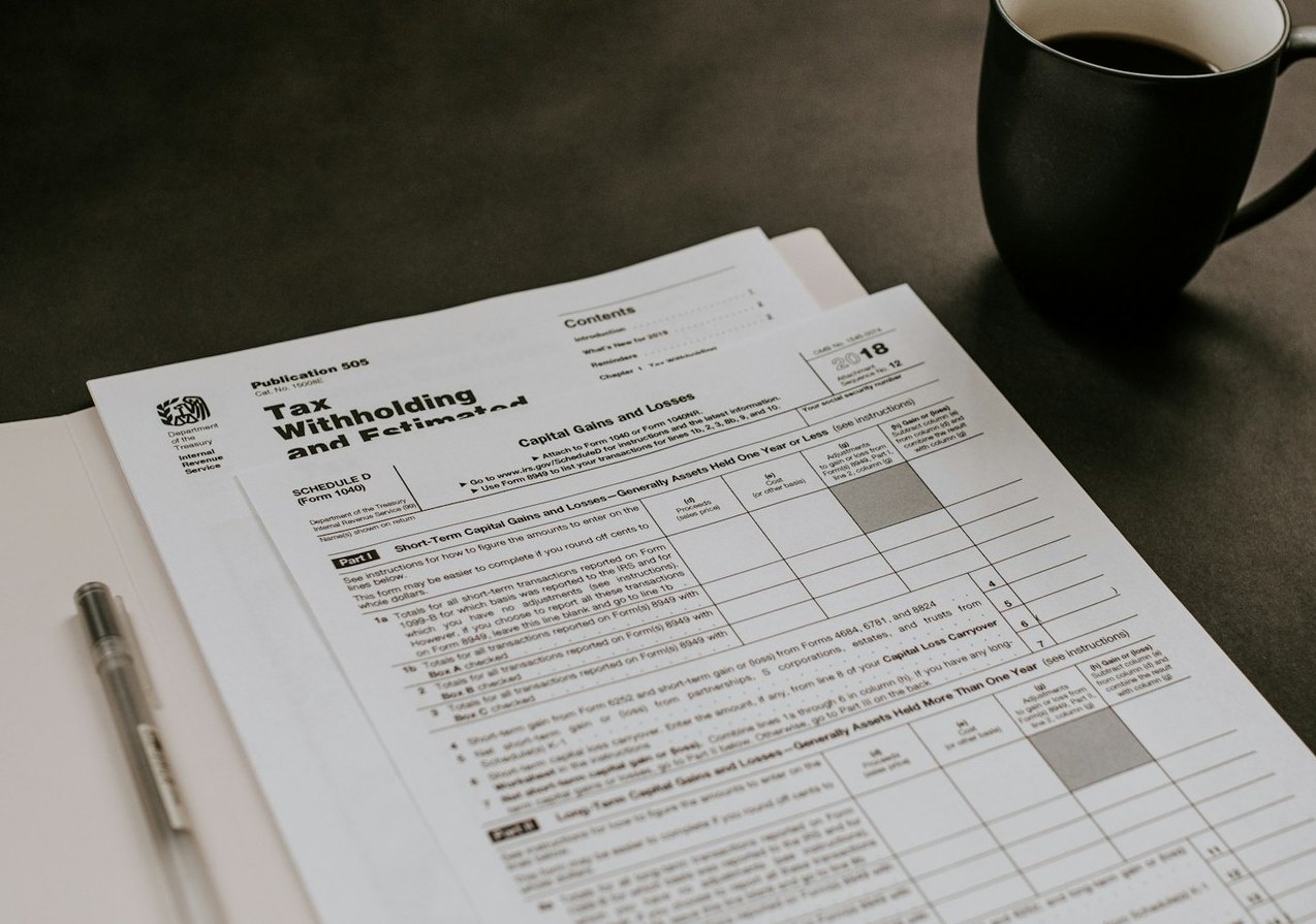 Real tax forms and paperwork on a desk